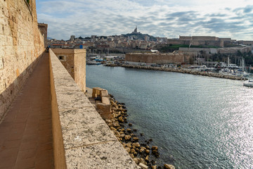 The scenic walkway on the exterior walls of the Fort Saint-Jean overlooking Marseille Old Port, France.