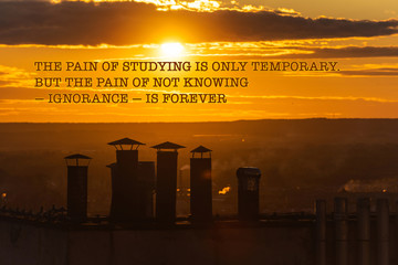 motivational inscription "THE PAIN OF STUDYING IS ONLY TEMPORARY. 
BUT THE PAIN OF NOT KNOWING — IGNORANCE — IS FOREVER" on the background of a city landscape with a beautiful sky and clouds at sunset