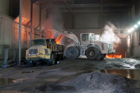 Germany, Steel mill, removal of slag with shovel excavator