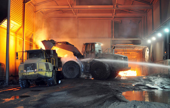 Germany, Steel mill, removal of slag with shovel excavator