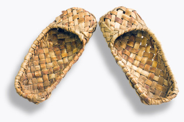 Bast shoes-traditional Russian peasant shoes close-up isolated on white background