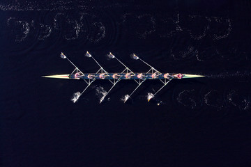 Elevated view of female's rowing eight in water