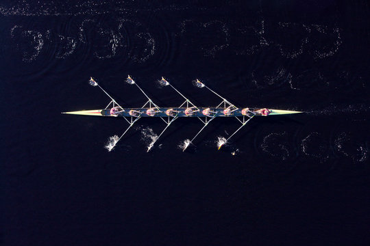 Elevated view of female's rowing eight in water