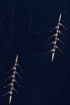Elevated view of two rowing eights in water