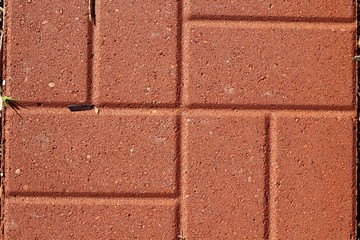 A close view of the red brick surface.