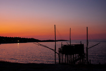 Fototapeta na wymiar Sunset at Trabucco, Vieste (Apulia), Italy