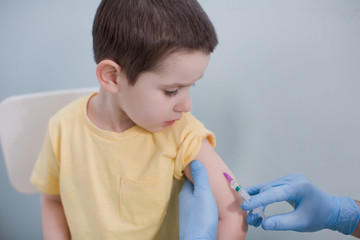 Vaccination concept with child in clinic
