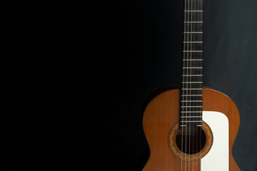 Spanish guitar on a black background