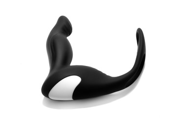 Black silicone prostate massager on white background. Anal plug.