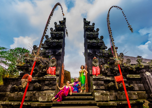 Women posing for photo at the Besakih Temple, the largest and holiest temple of Hindu religion in Bali, Indonesia, Southeast Asia, Asia