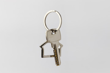 Macro view of silver key on the white background