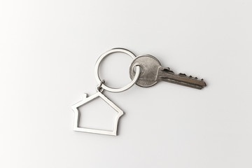 Macro view of silver key on the white background
