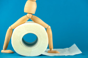 the wooden man and a roll of toilet paper, digestive problems