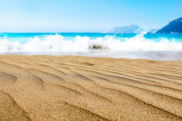 Fototapeta na wymiar Beautiful beach by the clear sea on a beautiful sunny holiday day