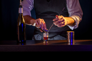Barman making B-52 cocktail shot
