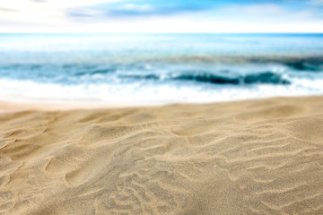 Naklejka na ściany i meble Beautiful beach by the clear sea on a beautiful sunny holiday day