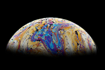 Soap bubble. Rainbow colors. Macro photo.