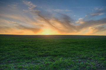 sunset over a freshly plowed field