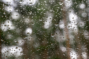 Water drops on car window. Rain on surface of window closeup. Natural background for your design. selective focus