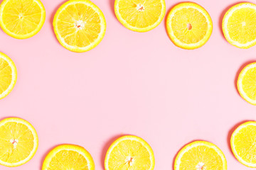  Frame of sliced ​​orange on a pink background. The concept of healthy food, vitamin C. Top view, copy space
