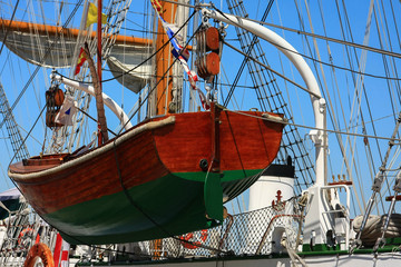 Old wooden sailing ship with a close up lifeboat