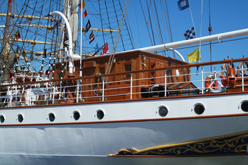 Back part of the sailboat with different flags