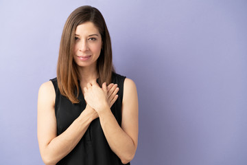 Fototapeta premium Woman showing empahty in a studio