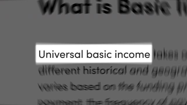 'Universal Basic Income' text centered among random paragraphs, similar to news articles on the web. Concept of UBI, citizen's basic income, basic income guarantee, basic living stipend.