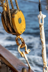 Pulleys, ropes, and mast of an old sailing yacht