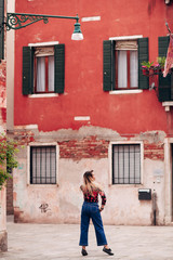 Fototapeta na wymiar girl walking in the italian city