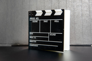 Movie clapper, movie slate notebook with a black background