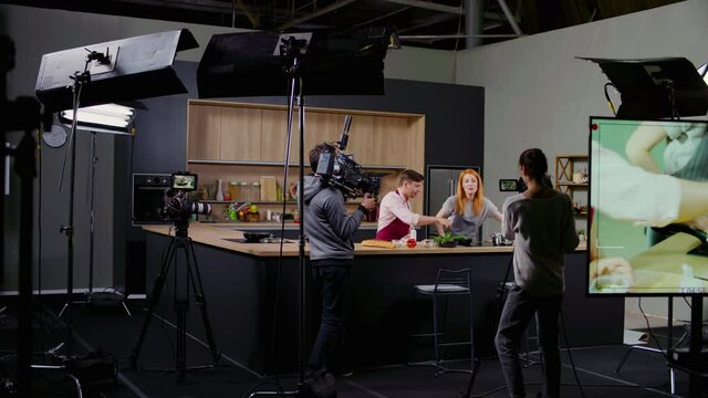 WIDE Behind the scenes of studio set, shooting TV television cooking show featuring celebrity chef, professional TV production. Shot on ARRI Alexa Mini