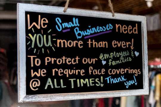 Sign On Business Re-opening After Covid 19 Requiring Facemask