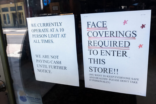 Sign On Business Re-opening After Covid 19 Requiring Facemask