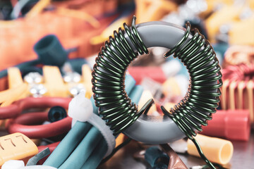 Copper coil and parts of electrical installation with blurred background