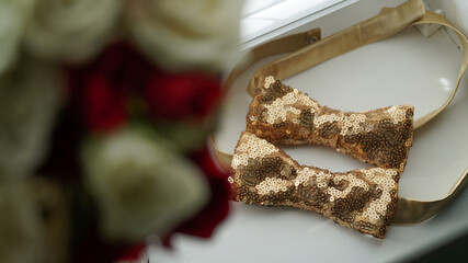 Gold butterflies for men on the windowsill
