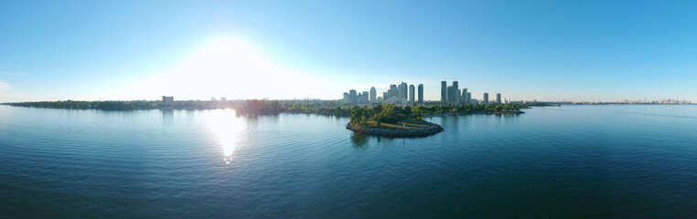Panorama of Humber Bay Shores Park city view, green space with skyline cityscape downtown. Skyscrapers over The Queensway on sunset at summer time, near Etobicoke or New Toronto, Ontario, Canada