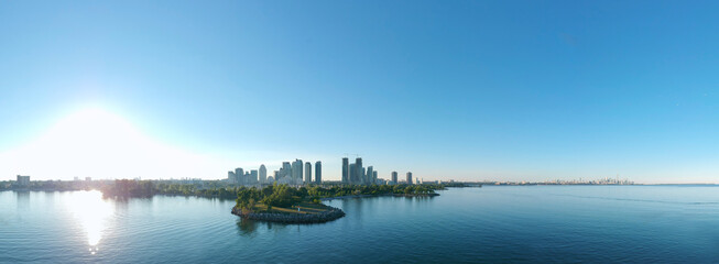 Panorama of Humber Bay Shores Park city view, green space with skyline cityscape downtown. Skyscrapers over The Queensway on sunset at summer time, near Etobicoke or New Toronto, Ontario, Canada