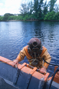 Historic Greek Sponge Diver In Antique Diving Suit Dives For Sponges In Tarpon Springs FL