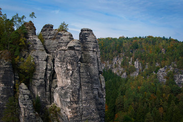 Fototapeta na wymiar The Bastei rocks in Saxon Switzerland National Park near Dresden, Germany on a sunny autumn day.
