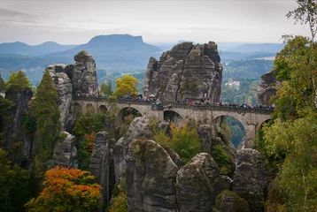 The Bastei stone bridge in the Saxon Switzerland National Park near Dresden, Germany on a foggy autumn day.
