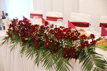 stylish table with fruits and flowers for a holiday on the outdo.