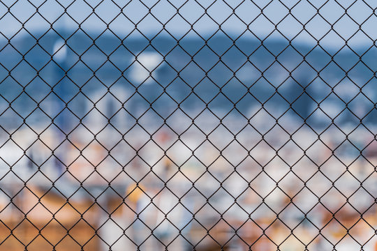 Chain Link Fence In Front Of City