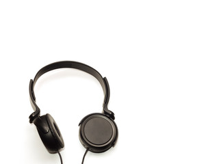 Fototapeta na wymiar Black headphone insulator with round embrasures on a white background