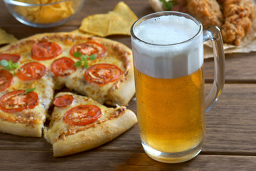 glass of beer with pizza Margarita
