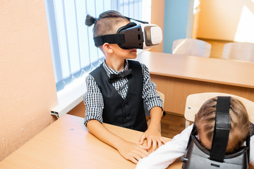 Children with virtual reality glasses. Teacher and students. Child Development: A New Kind of Learning