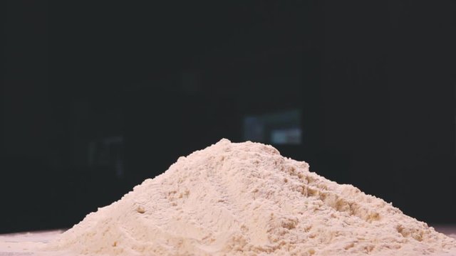 Rewind of falling piece of fresh meat into breadcrumbs