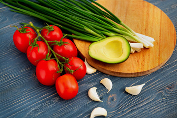 Various fresh vegetables on a blue rustic wooden table