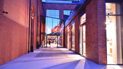 Revitalized red brick building and modern office building.