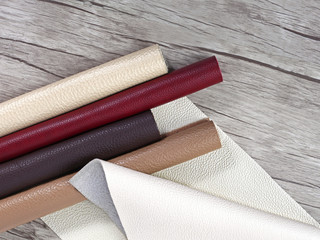 Rolled up multicolored natural leather textures samples